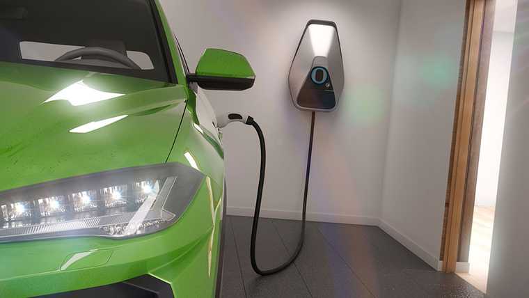 A green electric car is being charging