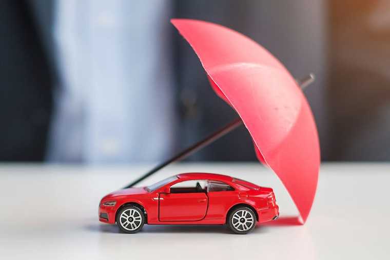 A red car model with a red umbrella