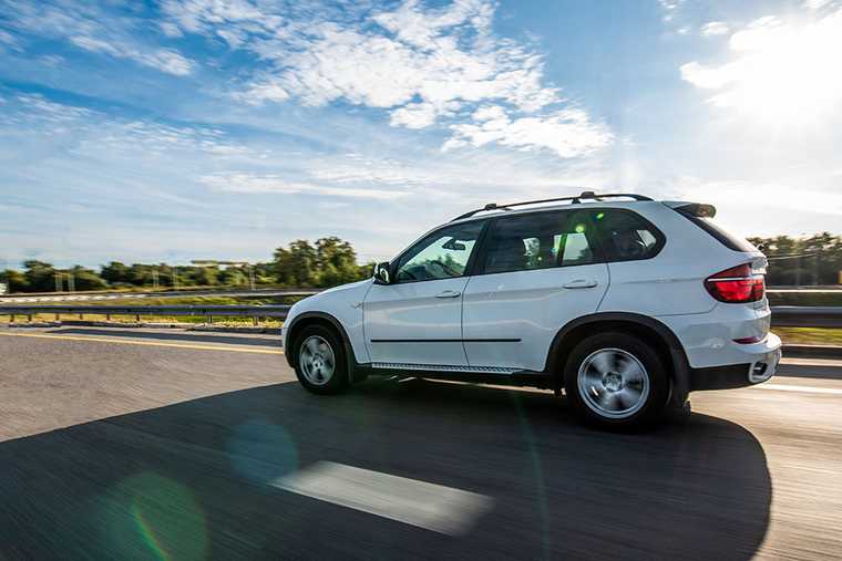 A white SUV on road